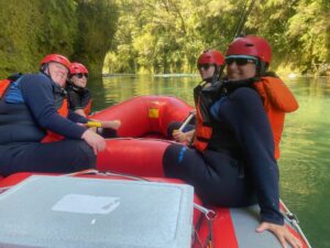 Family of four river rafting