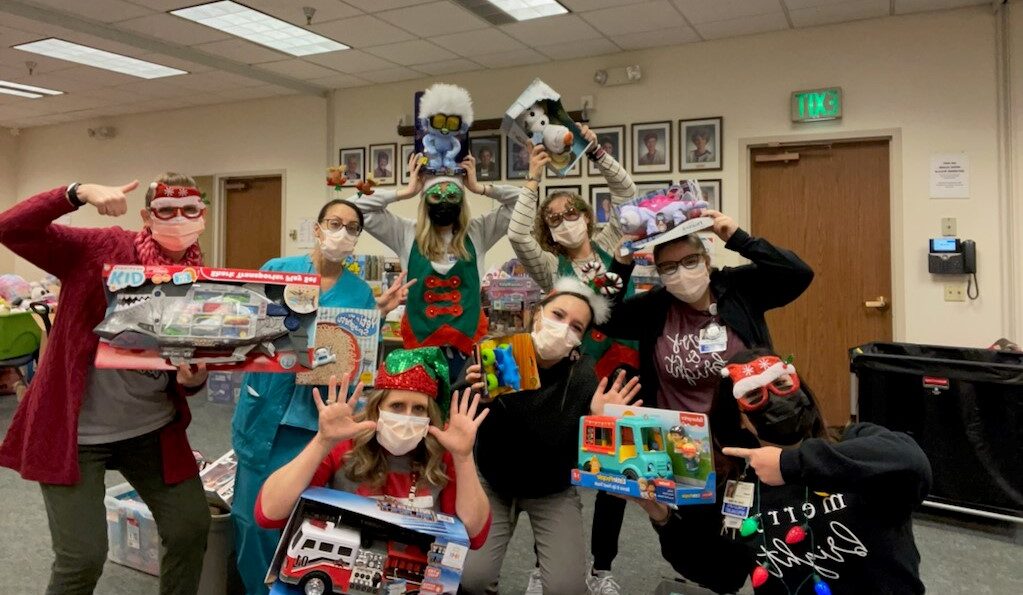 Child Life Services team and volunteers at Mary Bridge Children's Hospital hard at work in Santa's Workshop