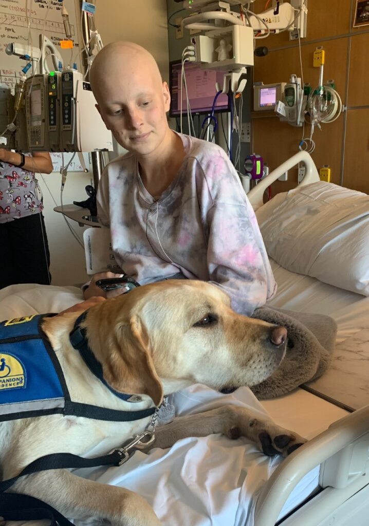 Bergen with Mary Bridge Children’s Facility Dog Olaf during treatment.