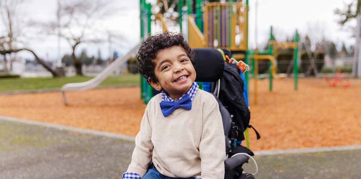 Carlos in his wheelchair at the playground