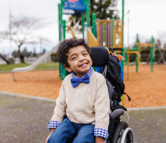 Carlos in his wheelchair at the playground