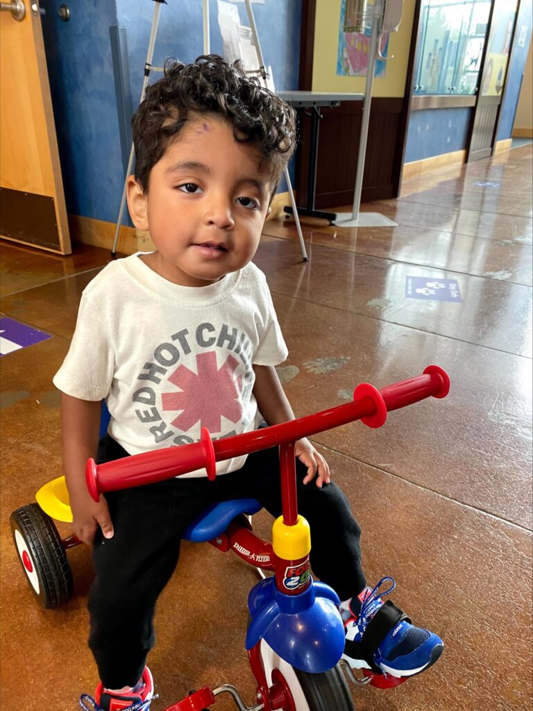 Carlos rides his mobility scooter at the Mary Bridge Good Samaritan Children’s Therapy Unit.