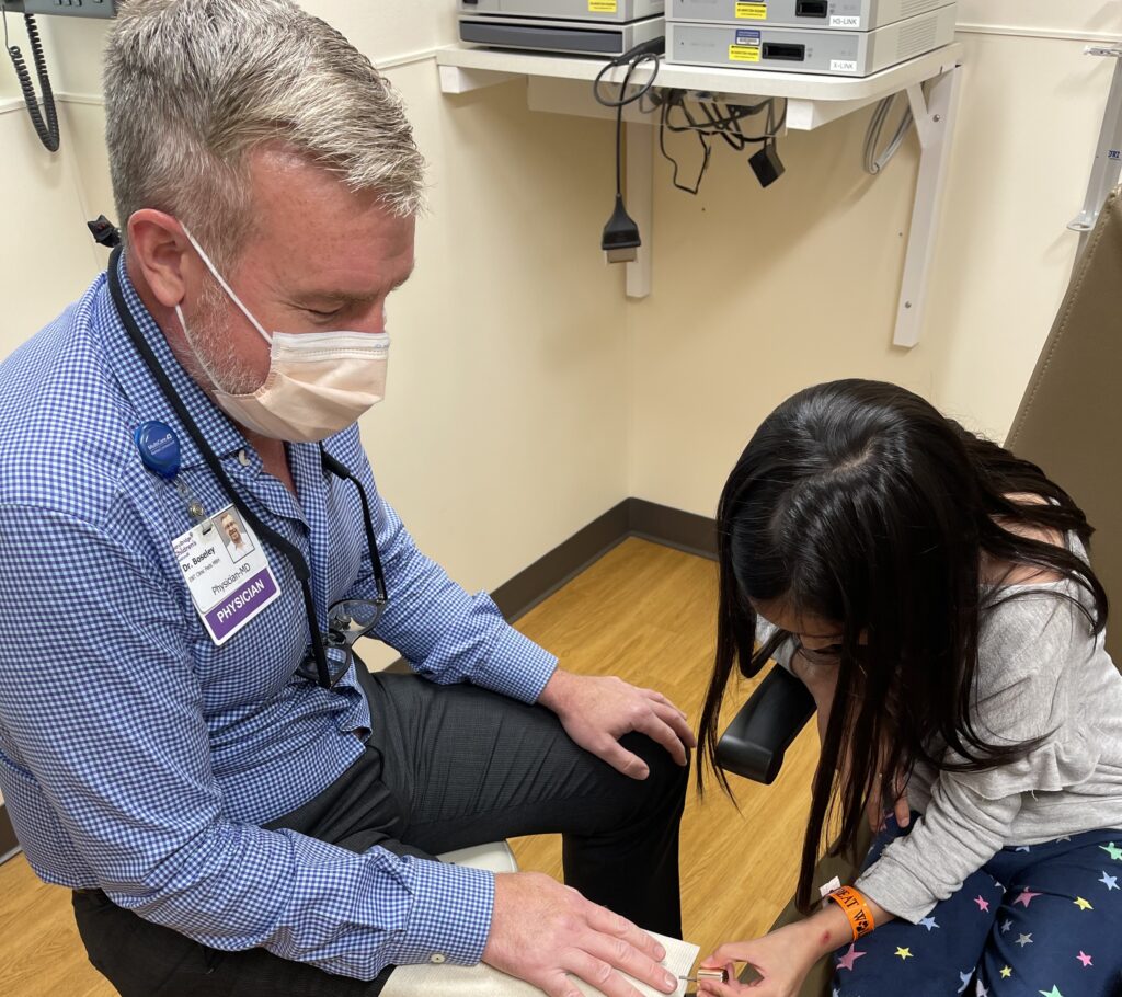 Jaida paints Dr. Boseley’s nails