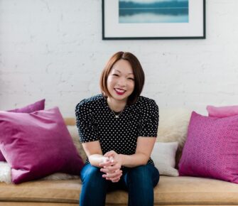 Tamara Chang, MD, sits on a couch.