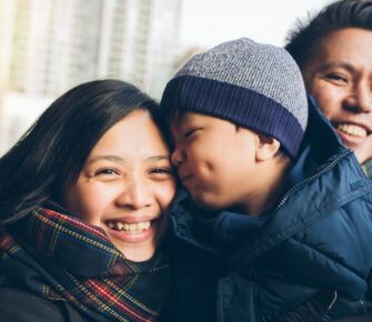 Bundled up family walks outside.