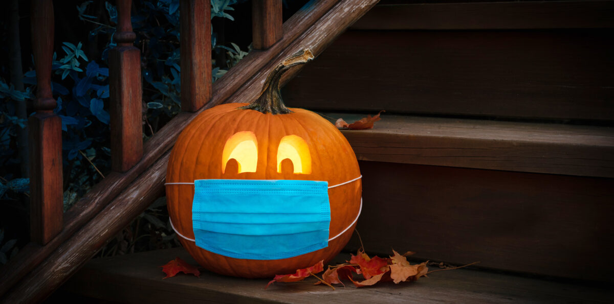 Lighted Halloween Pumpkin Jack o Lantern Wearing Covid PPE Mask On Steps