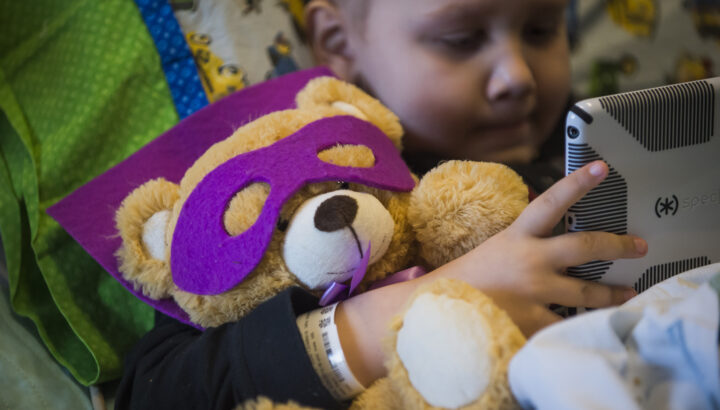 Patient snuggles super bear stuffed animal