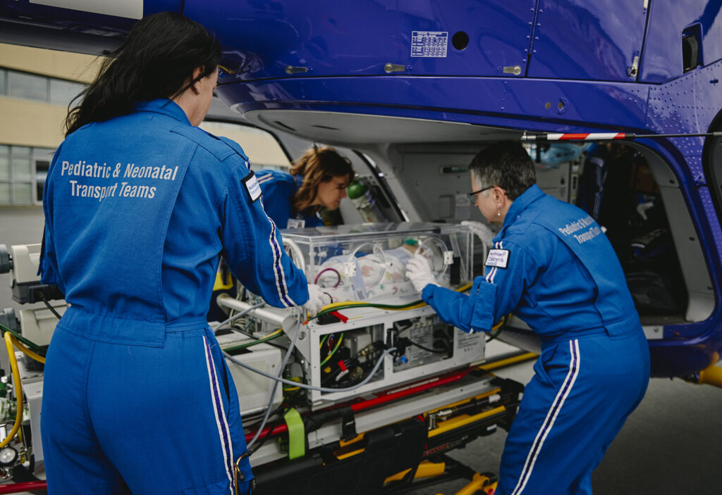 Mary Bridge Children's transport team loads a neonatal patient into Airlift Northwest’s helicopter.