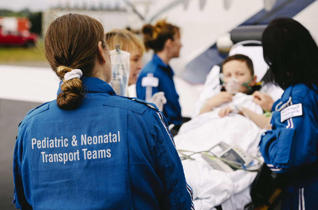 Mary Bridge Children's transport team loads a patient into Airlift Northwest’s fixed-wing plane.