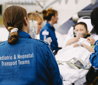 Mary Bridge Children's transport team loads a patient into Airlift Northwest’s fixed-wing plane.