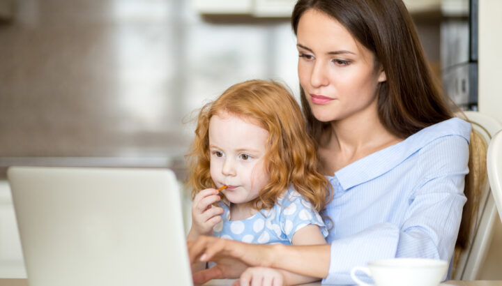 Mother and daughter on computer