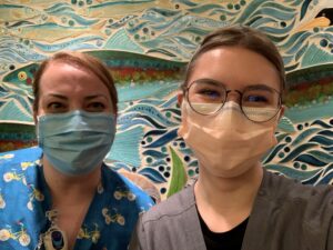 Nicole Geffrey, RN, and Emily posing for a picture together at Mary Bridge Children's Hospital.