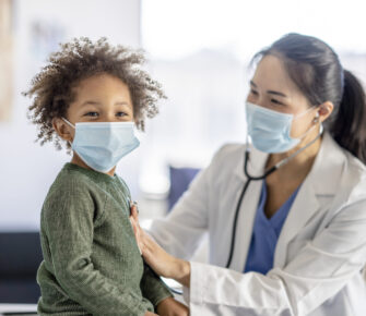 Doctor Giving a Little Boy a Physical Examination