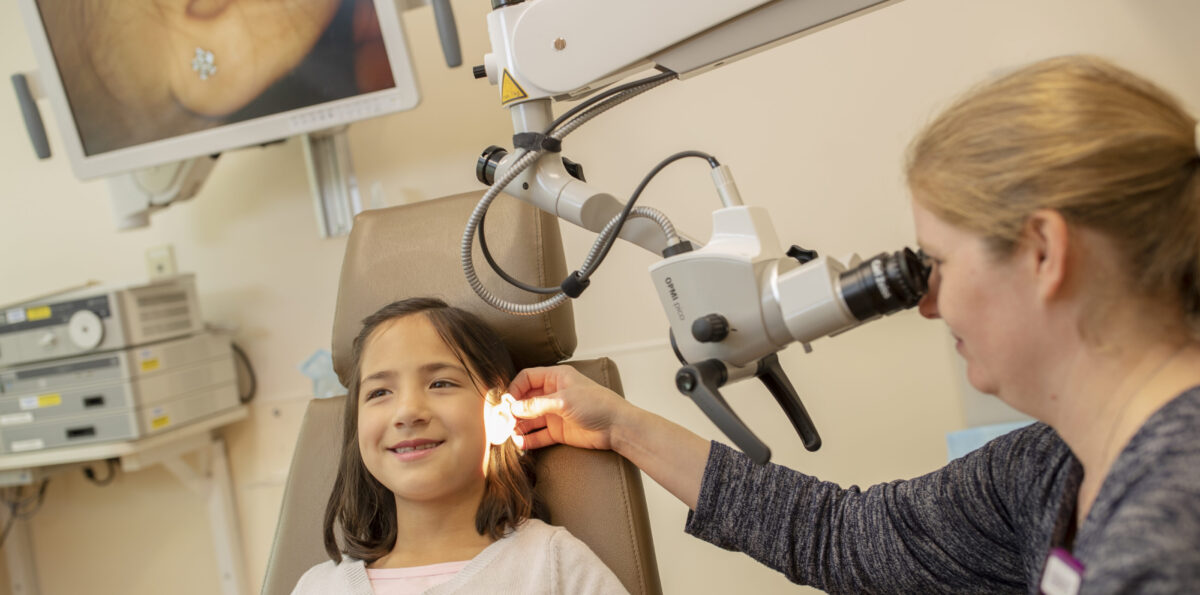 Young girl having her ear examined in a medical clinic.