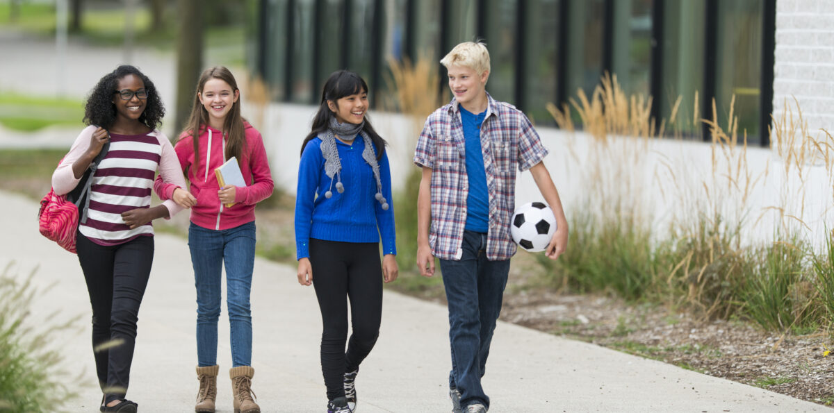 Diverse group of junior high students outside of school