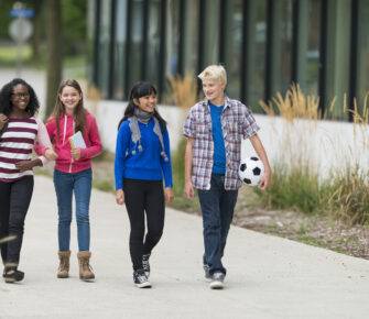 Diverse group of junior high students outside of school